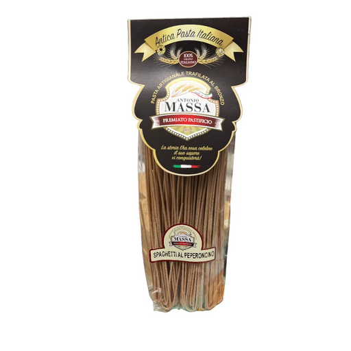 Packaged spaghetti with pepperoni from Antica Pasta Italiana on a cluttered kitchen counter.