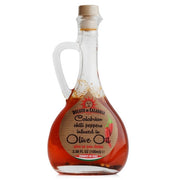 Bottle of Collyer's Calabrian chili peppers infused in olive oil on a white background