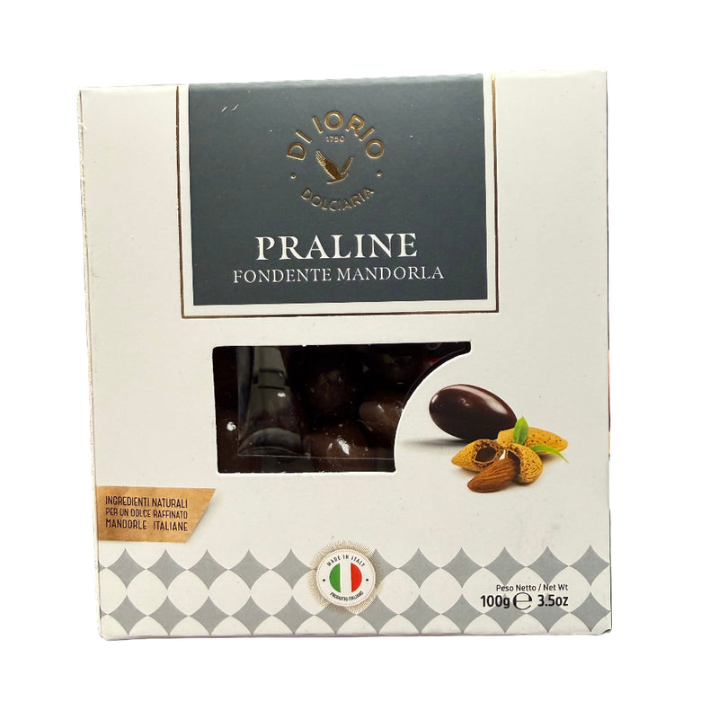 Box of Diorio Praline Fondente Mandorla held in a hand with a blurred background.
