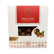 Box of Vicolo Praline Latte Nocciola held in a hand with a blurred background