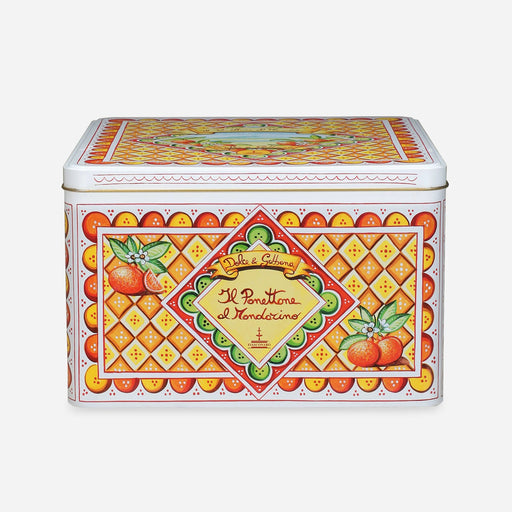 Decorative tin box with colorful design and text on a white background