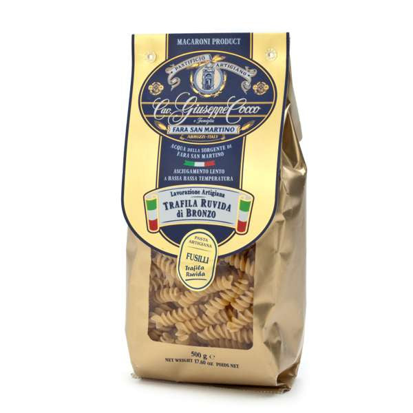 Pasta package with a gold and blue label on a white background