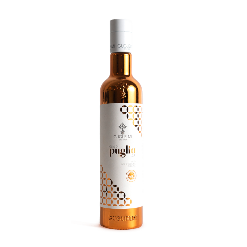 A bottle of Guglielmi Puglia Igp Olive Oil with a white label and gold accents on a copper-colored cap.