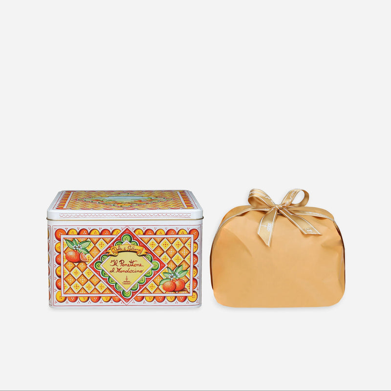 Decorative box with a pattern and a wrapped item on a white background