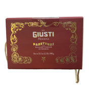 Red box of Giusti Modena Panettone with Balsamic Vinegar held in a store setting