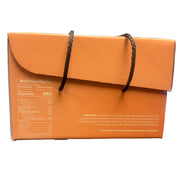 Orange box with a handle held in front of a store shelf