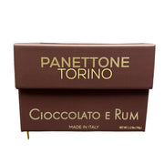 Panettone Torino Cioccolato e Rum box held in a store setting