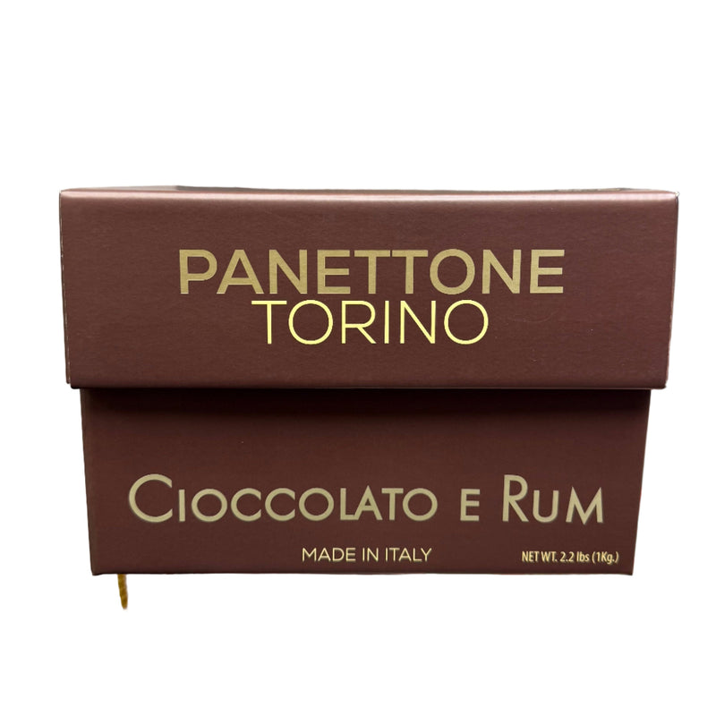 Panettone Torino Cioccolato e Rum box held in a store setting