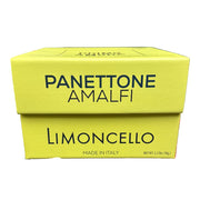 Yellow box of Panettone Amalfi Limoncello held in a hand with a store background.
