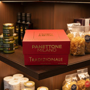 Red box of Panettone Milano Tradizionale held in a store setting