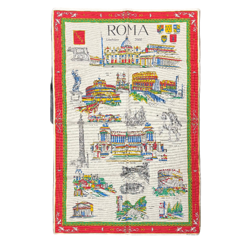 Map of Rome on a decorative mat with a red border, placed on a textured surface.