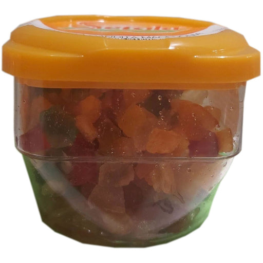A plastic container with a yellow lid containing diced candied fruits.