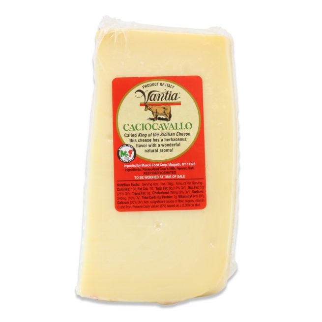 Block of cheese with a Vanilla brand label on a white background