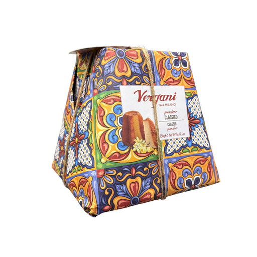 Colorful package with a 'Vergani' label held in front of a store setting.