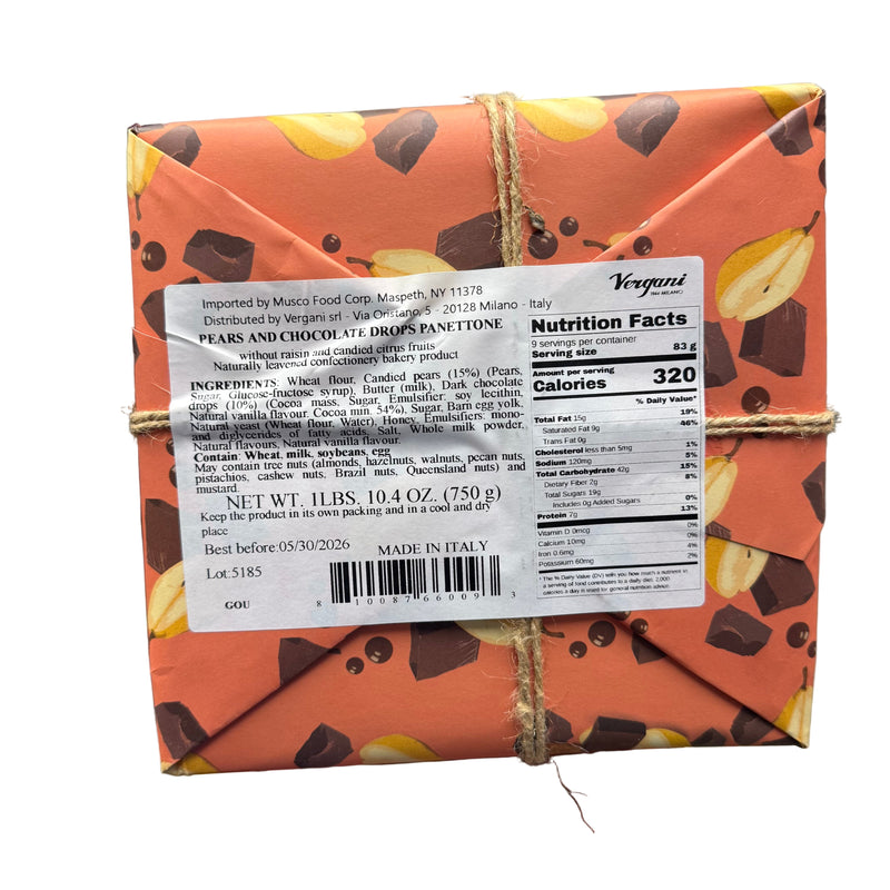 Hand holding a box of Vergani Panettone with pears and chocolate in a store setting