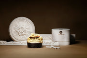 Decorative white wall art piece with a container labeled 'Ice Preserver' and a small black basket with popcorn on a dark background.