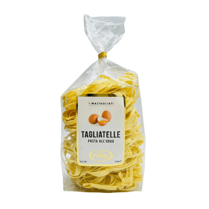 Packaged tagliatelle pasta with a label on a white background