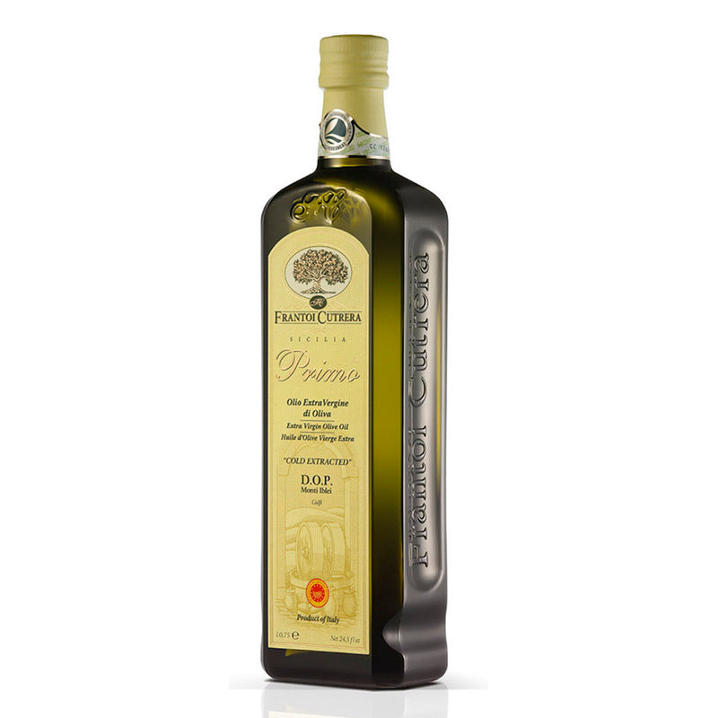 A bottle of Frantoi Cutrera Primo Extra Virgin Olive Oil with label information in Italian.